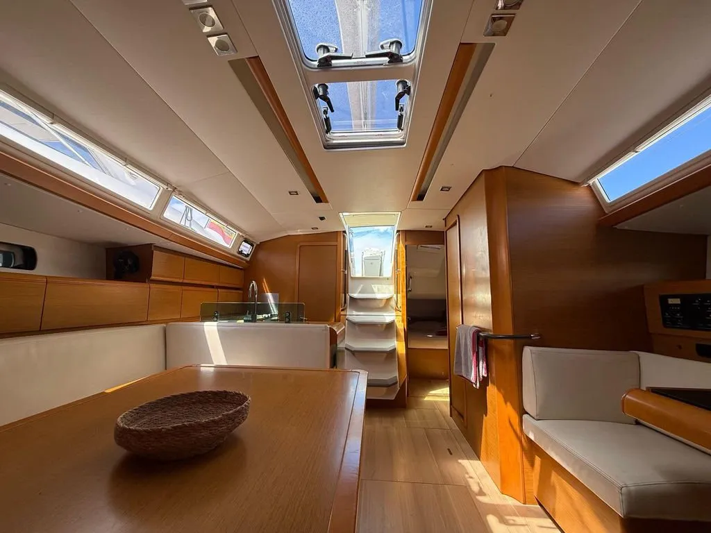 Salon of Mientras Tanto, a Jeanneau Sun Odyssey 449 sailboat at Ibiza, Spain
