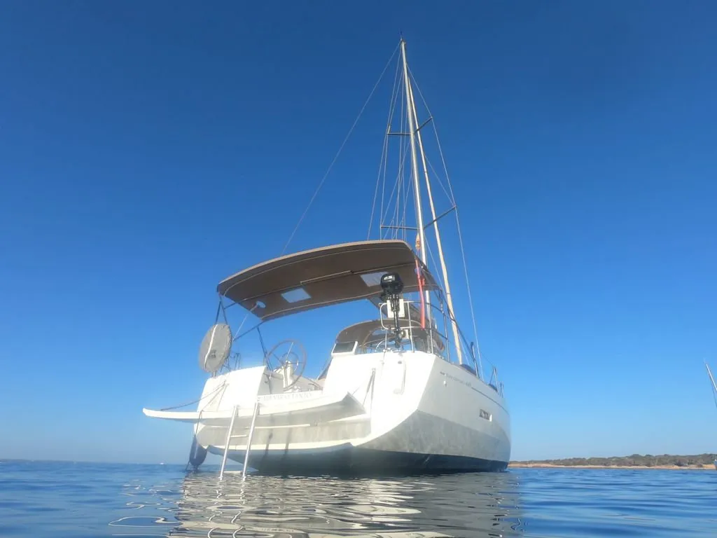 Exterior view of Mientras Tanto, a Jeanneau Sun Odyssey 449 sailboat at Ibiza, Spain
