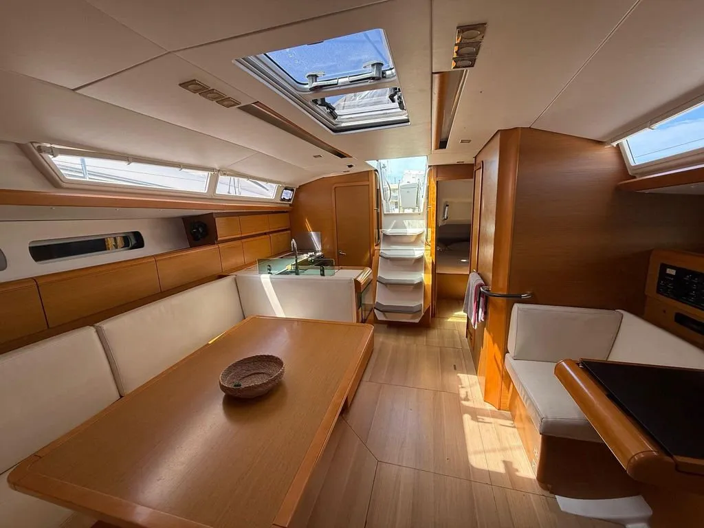 Salon of Mientras Tanto, a Jeanneau Sun Odyssey 449 sailboat at Ibiza, Spain