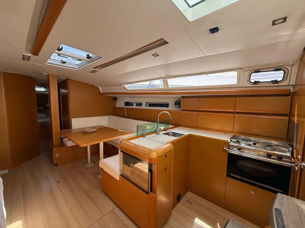 Salon of Mientras Tanto, a Jeanneau Sun Odyssey 449 sailboat at Ibiza, Spain