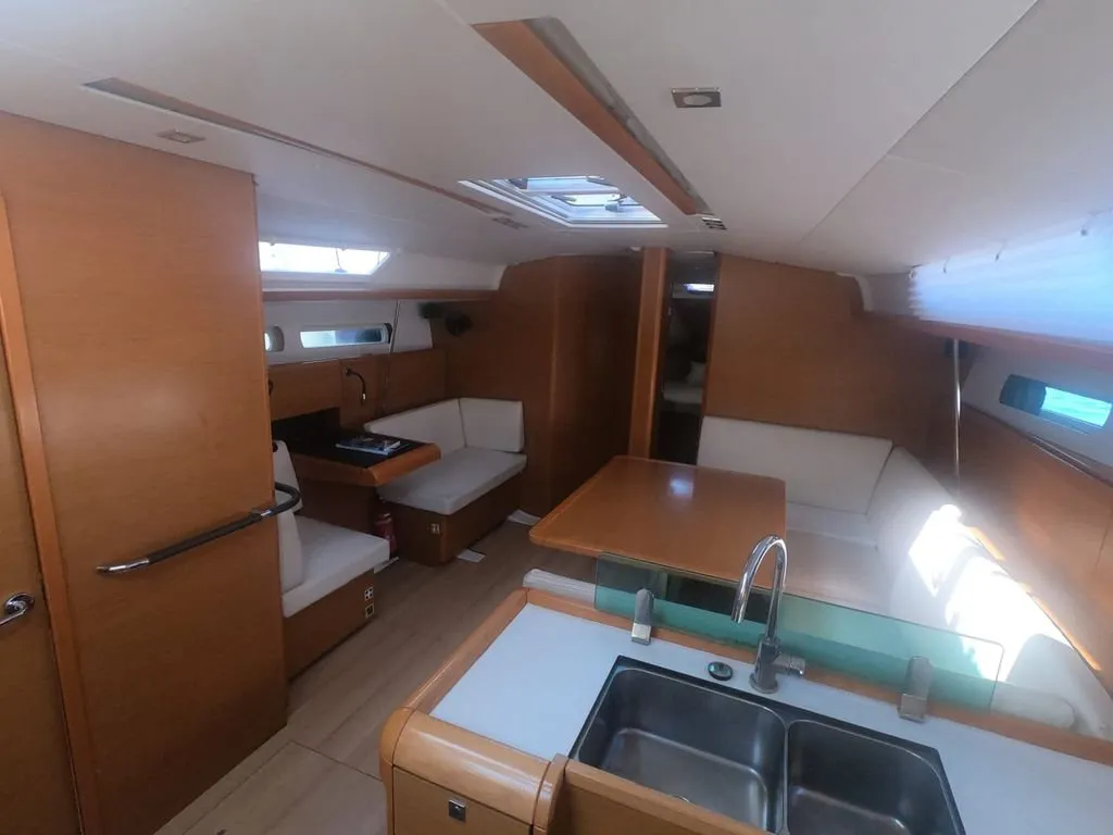Salon of Mientras Tanto, a Jeanneau Sun Odyssey 449 sailboat at Ibiza, Spain