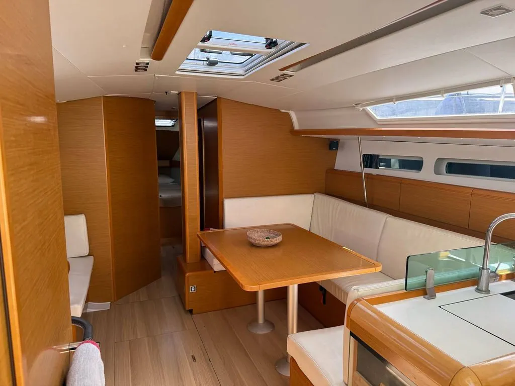Salon of Mientras Tanto, a Jeanneau Sun Odyssey 449 sailboat at Ibiza, Spain