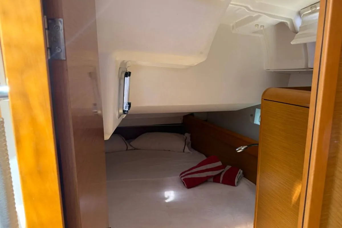 Exterior view of Mientras Tanto, a Jeanneau Sun Odyssey 449 sailboat at Ibiza, Spain