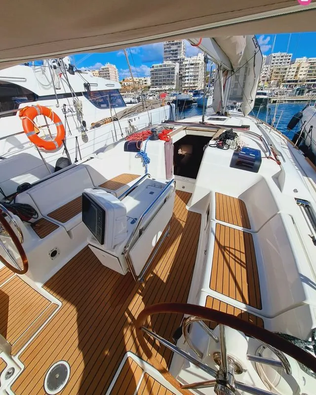 Exterior view of Mientras Tanto, a Jeanneau Sun Odyssey 449 sailboat at Ibiza, Spain