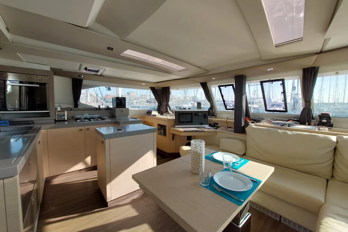 Salon of Ancora Reha, a Fountaine Pajot Saona 47 catamaran at Rosignano Solvay, Italy