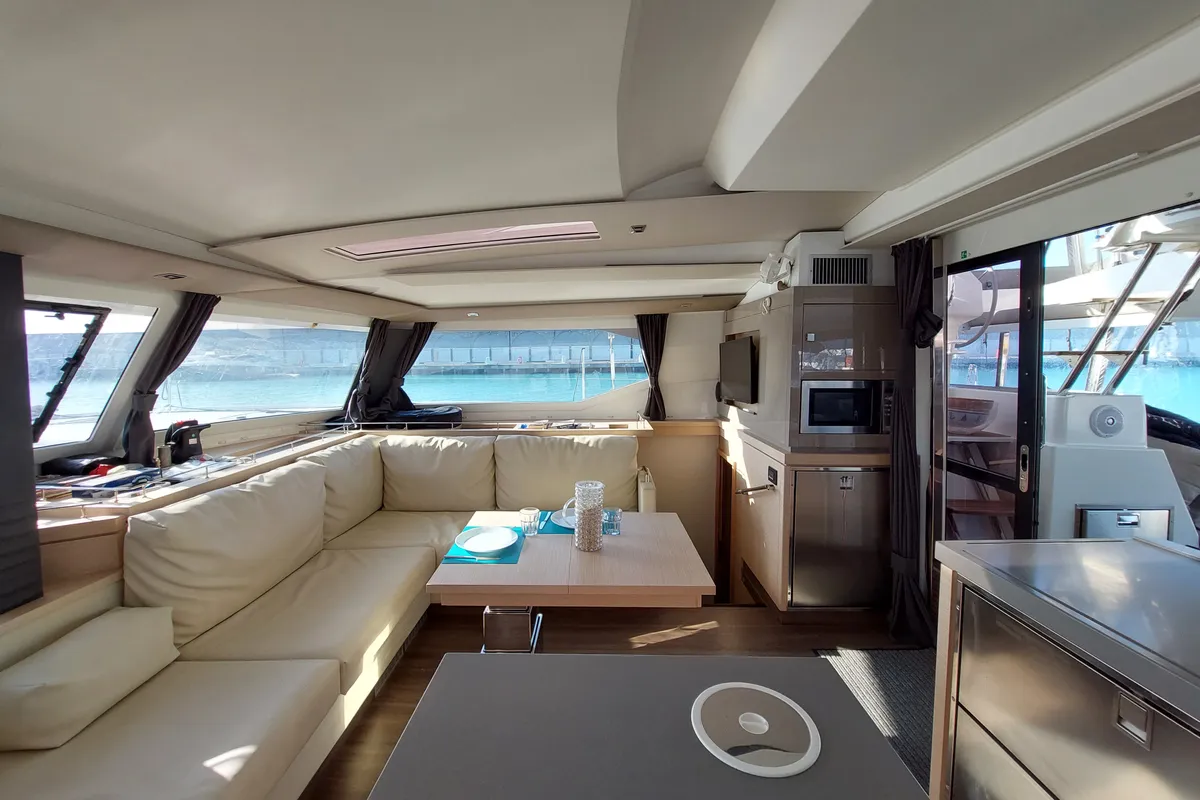 Salon of Ancora Reha, a Fountaine Pajot Saona 47 catamaran at Rosignano Solvay, Italy