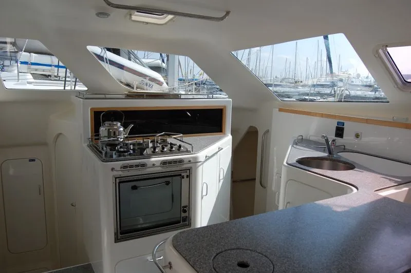 Galley of Alboran Ron Punch (Majorca), a Voyage 440 catamaran at es Jonquet, Spain