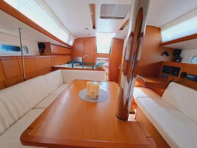 Salon of EMILINA, a Jeanneau Sun Odyssey 389 sailboat at Sant Antoni de Portmany, Spain