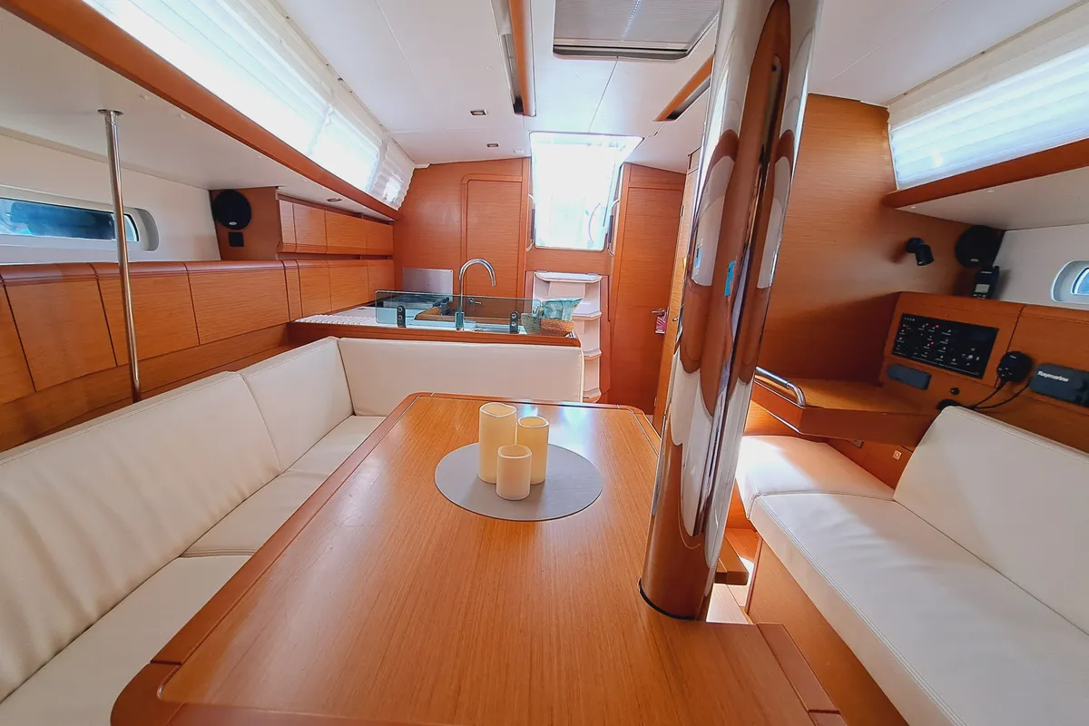 Salon of EMILINA, a Jeanneau Sun Odyssey 389 sailboat at Sant Antoni de Portmany, Spain