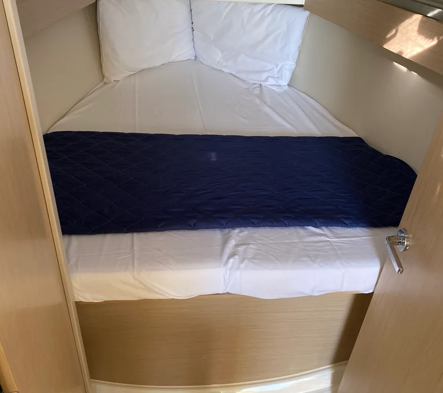 Cabin on Carina, a Beneteau Oceanis 30.1 sailboat at Olbia, Italy