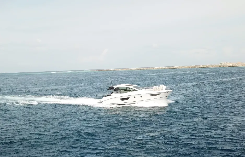 Exterior view of Island Cruise, a Beneteau GT40 motorboat at Malé, Maldives