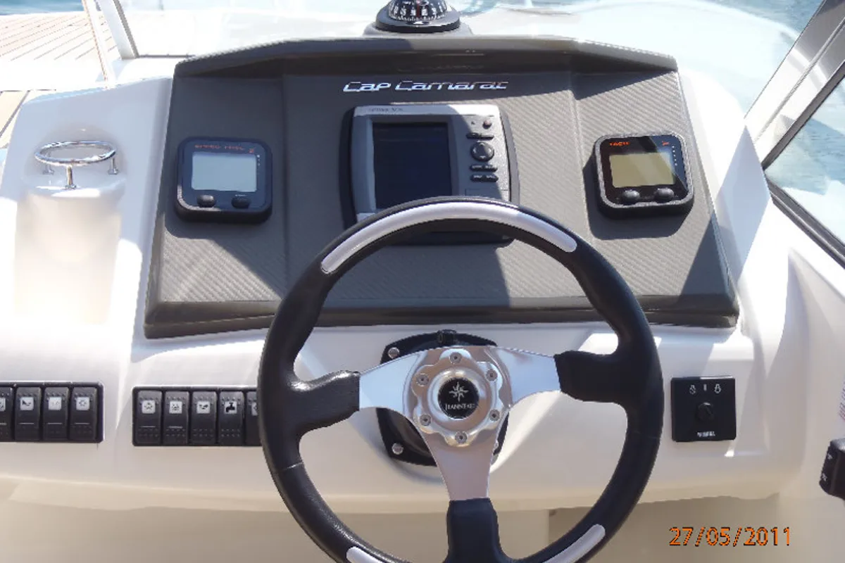 Cockpit of Cap Camarat, a Jeanneau Cap Camarat 7.5 CC motorboat at Sitges, Spain