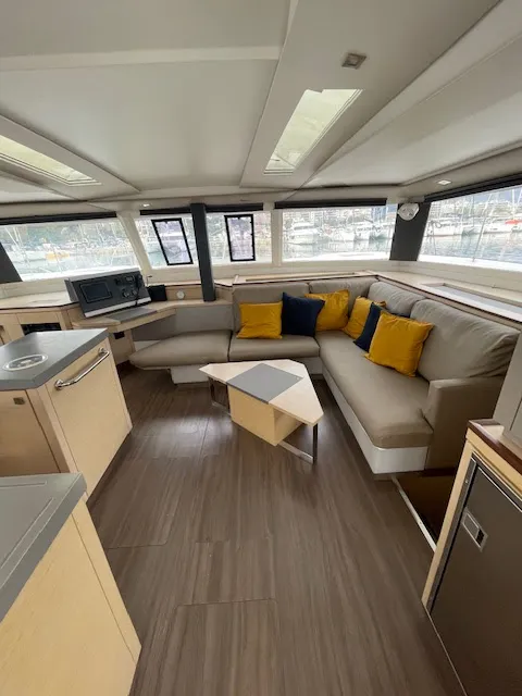 Salon of Red Rose, a Fountaine Pajot Saona 47 Quintet catamaran at Agios Stefanos, Greece