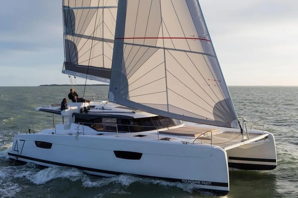 Exterior view of Red Rose, a Fountaine Pajot Saona 47 Quintet catamaran at Agios Stefanos, Greece