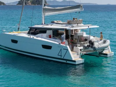 Exterior view of Red Rose, a Fountaine Pajot Saona 47 Quintet catamaran at Agios Stefanos, Greece