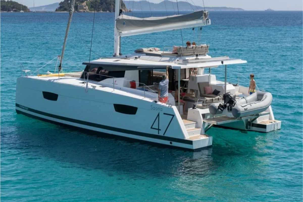 Exterior view of Red Rose, a Fountaine Pajot Saona 47 Quintet catamaran at Agios Stefanos, Greece