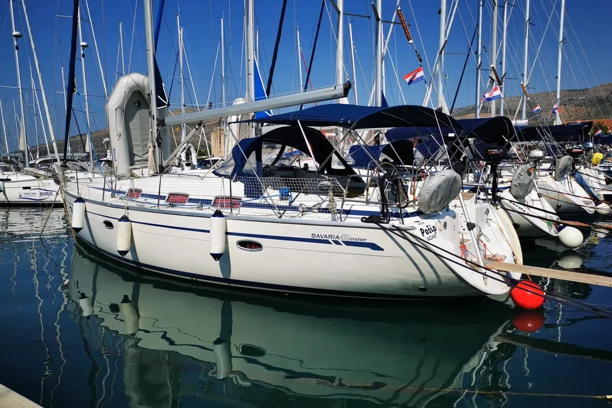 Exterior view of Pošip, a Bavaria 42 Cruiser sailboat at Grad Trogir, Croatia