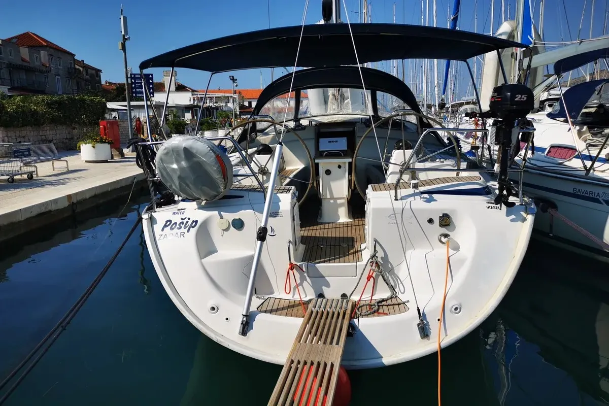 Exterior view of Pošip, a Bavaria 42 Cruiser sailboat at Grad Trogir, Croatia