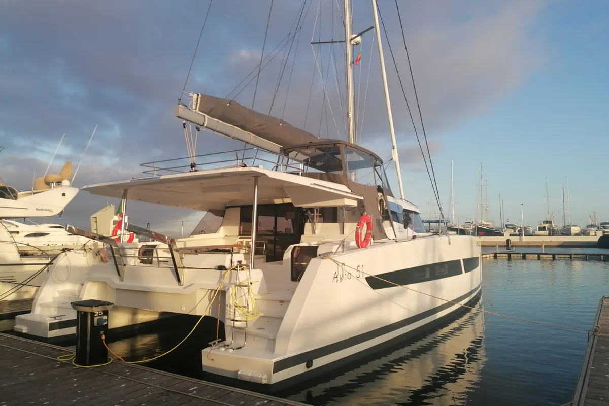 Exterior view of Papa Charlie, a Fountaine Pajot Aura 51 catamaran at Cannigione, Italy