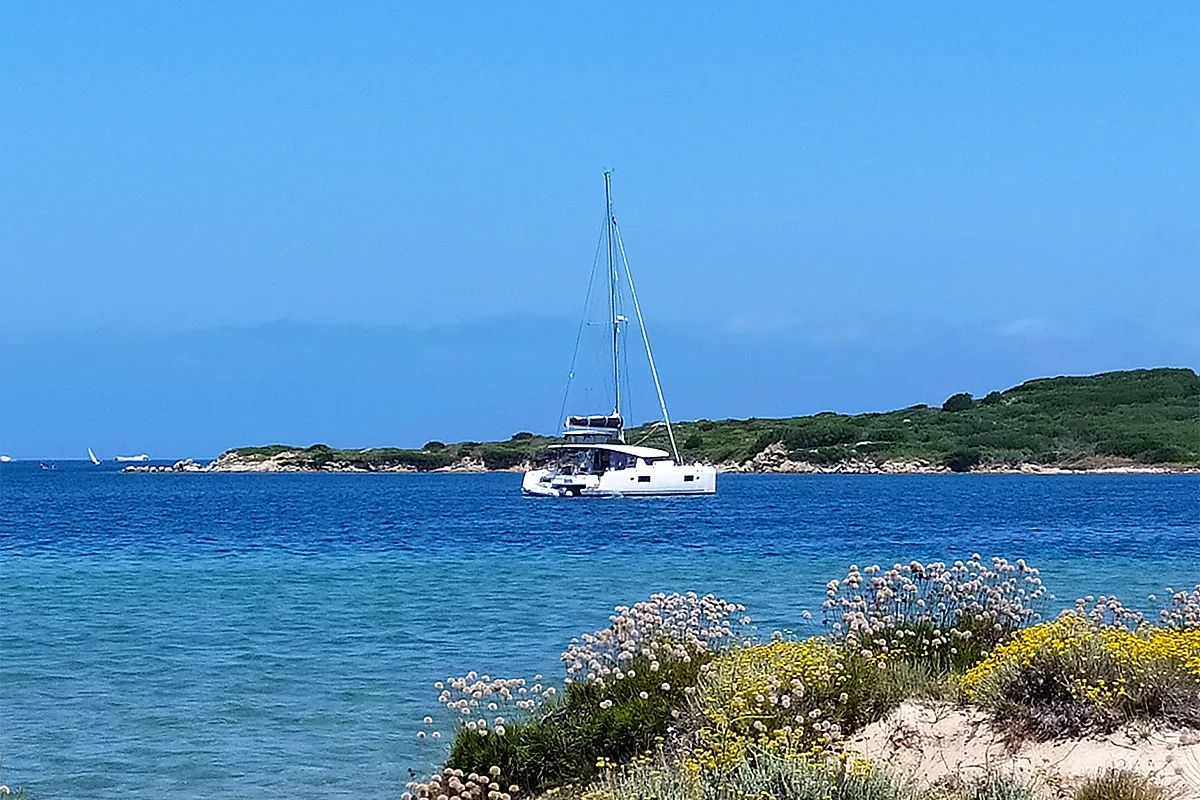 Exterior view of Pollo, a Lagoon 450 Fly catamaran at Lu Palau/Palau, Italy