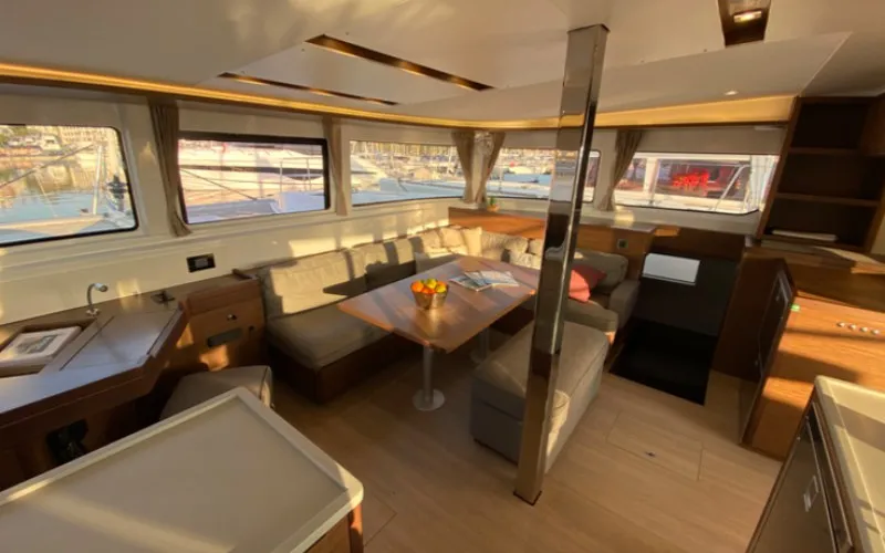 Salon of Les Jumeaux, a Lagoon 46 OW catamaran at Ventimiglia, Italy