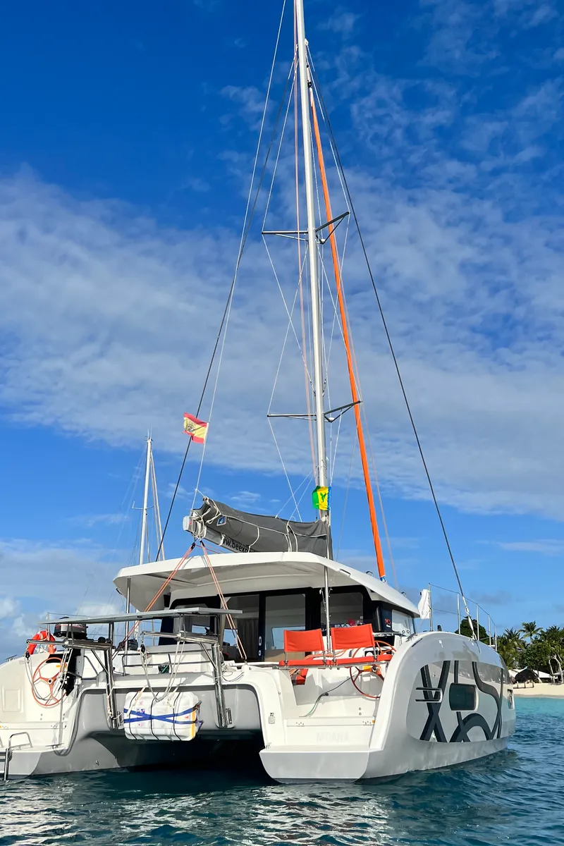 Exterior view of ONE Mallorca BAREBOAT, a Excess 11 catamaran at Port d'Andratx, Spain
