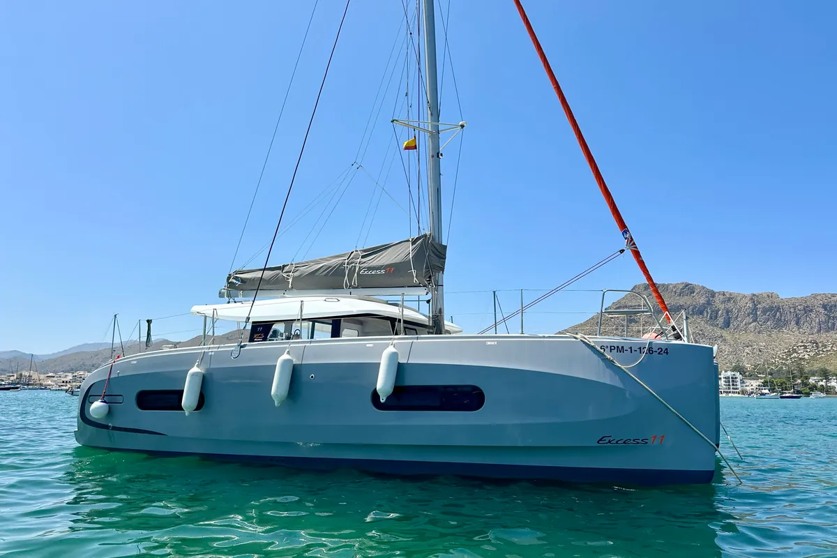 Exterior view of Floki, a Excess 11 catamaran at Port de Pollença, Spain