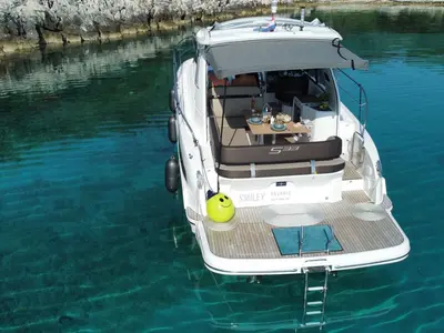 Smiley, a Bavaria 33 Sport HT motorboat at Punat, Croatia