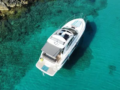 Smiley, a Bavaria 33 Sport HT motorboat at Punat, Croatia