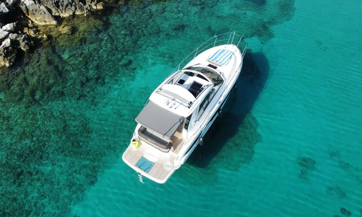 Smiley, a Bavaria 33 Sport HT motorboat at Punat, Croatia