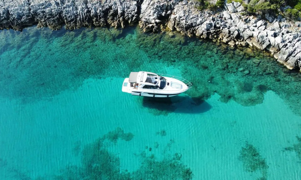 Smiley, a Bavaria 33 Sport HT motorboat at Punat, Croatia