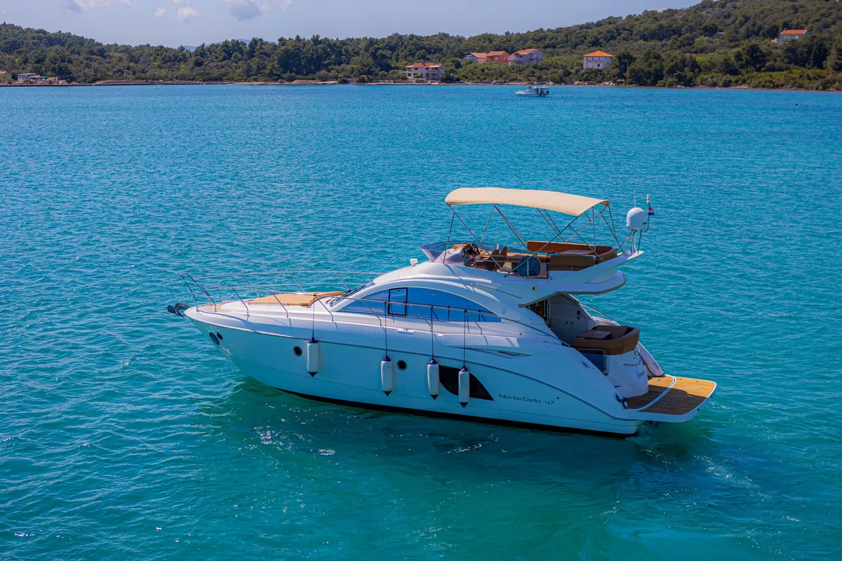 Exterior view of Lamona, a Beneteau Monte Carlo 47 Fly motor yacht at Općina Sukošan, Croatia