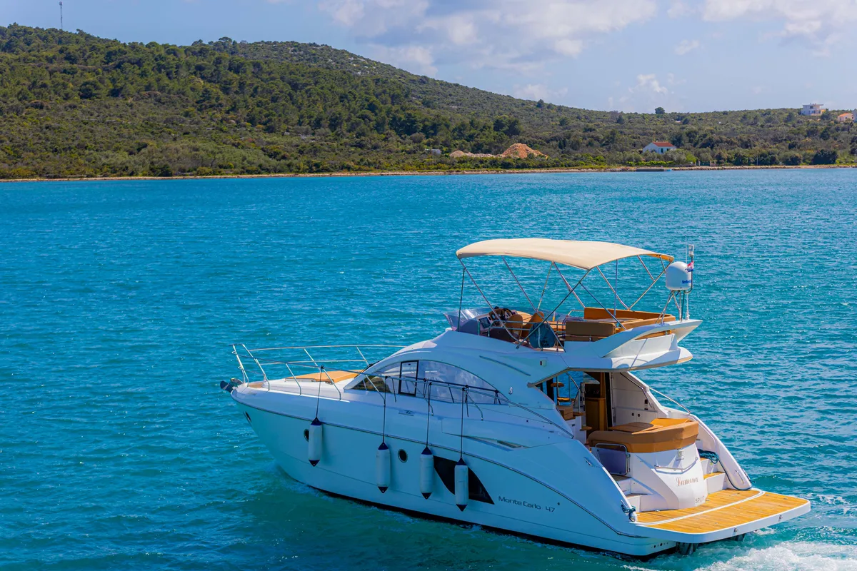 Exterior view of Lamona, a Beneteau Monte Carlo 47 Fly motor yacht at Općina Sukošan, Croatia