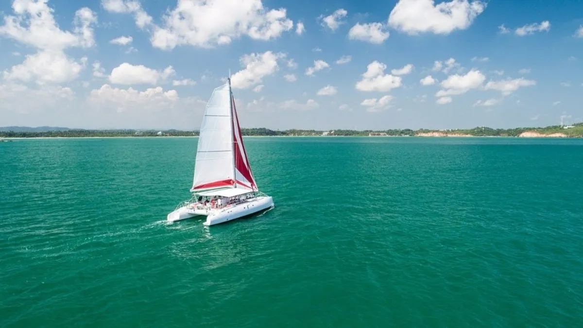Exterior view of Poe Nui, a Gulet Ocean Voyager 53 catamaran at Papeete, France