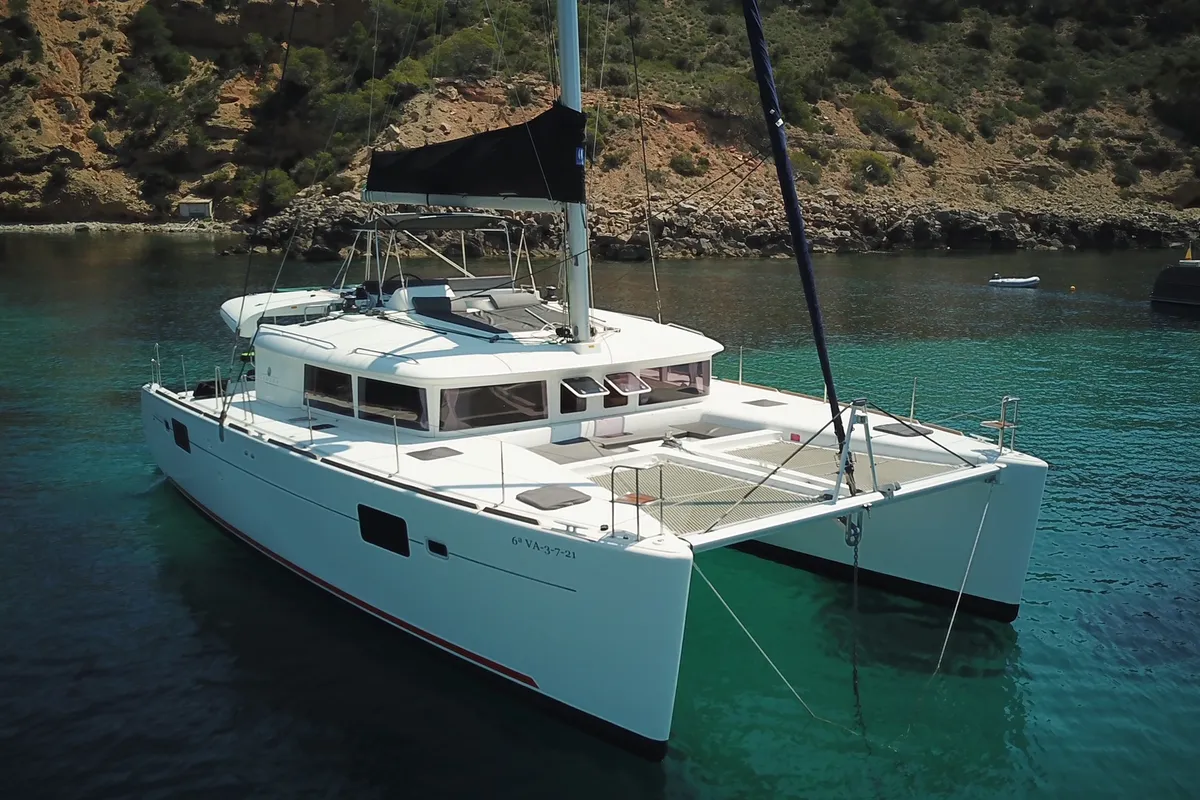 Exterior view of Fornes, a Lagoon 450 Fly catamaran at Ibiza, Spain
