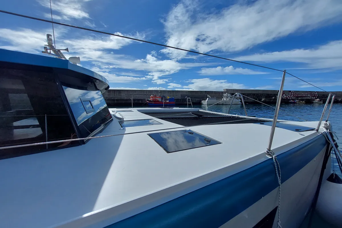 Exterior view of Turquoise, a Luna 47 Power catamaran at Funchal, Portugal