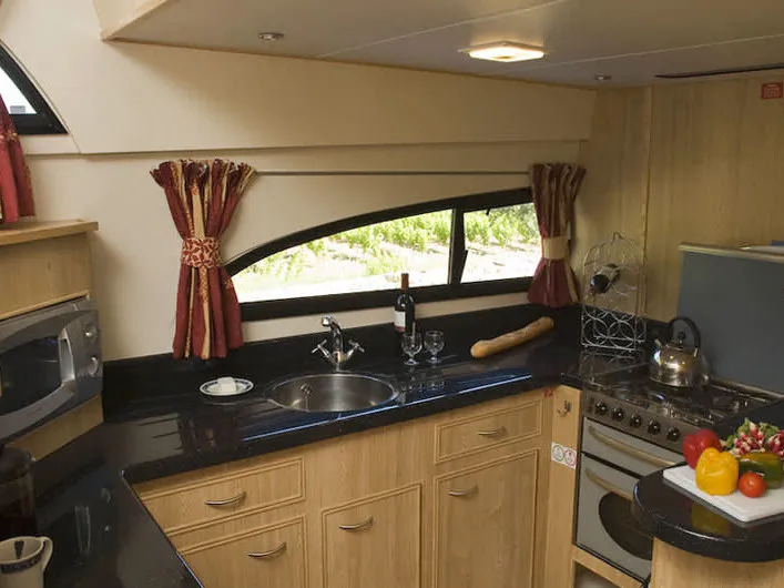 Galley of Cygnet Royal Mystique, a motorboat at Borough of Runnymede, United Kingdom