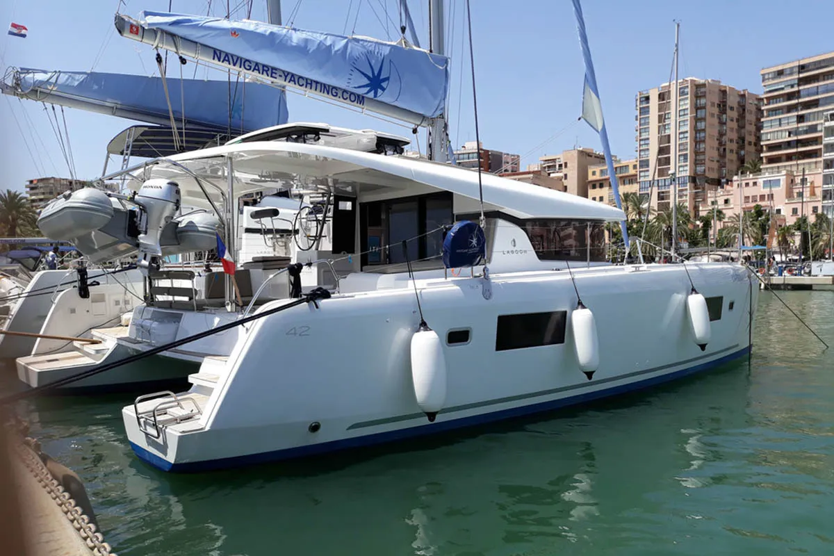 Exterior view of l'Argonaute 461/2025, a Lagoon 42 catamaran at Palma de Mallorca, Spain