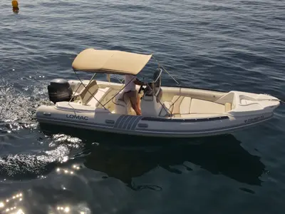Exterior view of Fura, a Lomac Turismo 675 motorboat at Palamós, Spain