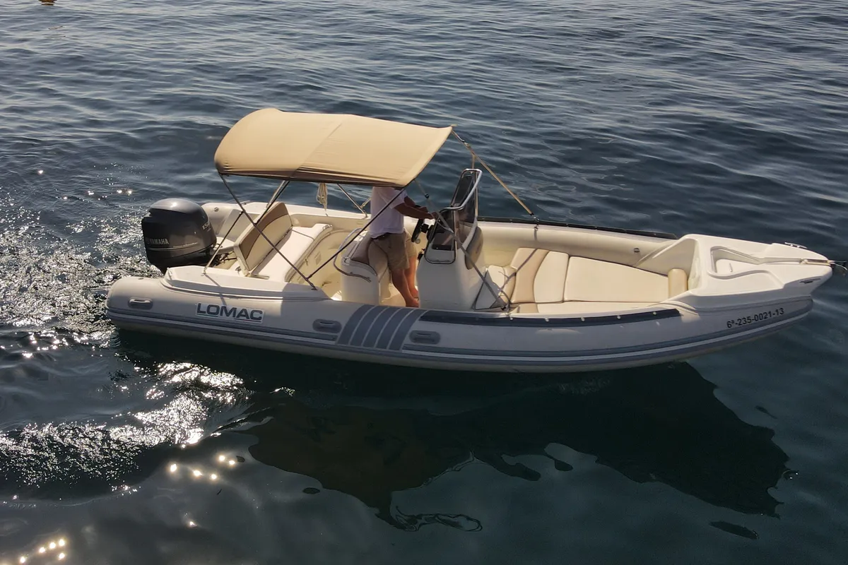 Exterior view of Fura, a Lomac Turismo 675 motorboat at Palamós, Spain