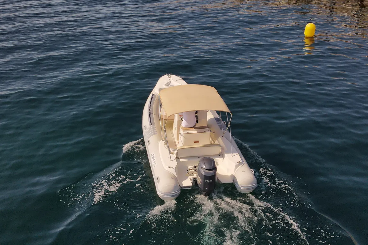 Exterior view of Fura, a Lomac Turismo 675 motorboat at Palamós, Spain