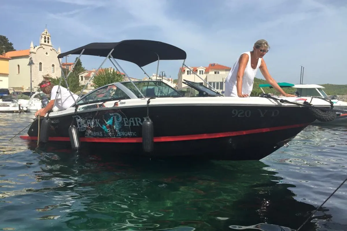 Exterior view of Black Pearl, a Four Winns H210 motorboat at Tribunj, Croatia