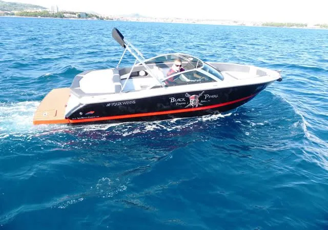 Exterior view of Black Pearl, a Four Winns H210 motorboat at Tribunj, Croatia
