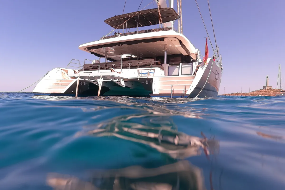 Exterior view of ZS, a Lagoon 620 catamaran at Ibiza, Spain