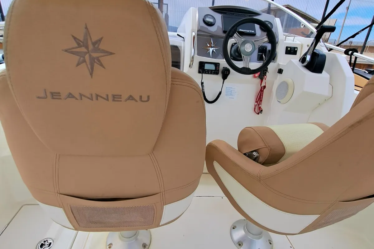 Cockpit of CORRECAMINOS BEEP BEEP, a Jeanneau Cap Camarat 755WA motorboat at Sant Antoni de Portmany, Spain