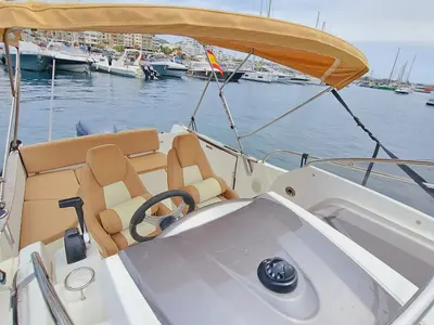 Cockpit of CORRECAMINOS BEEP BEEP, a Jeanneau Cap Camarat 755WA motorboat at Sant Antoni de Portmany, Spain