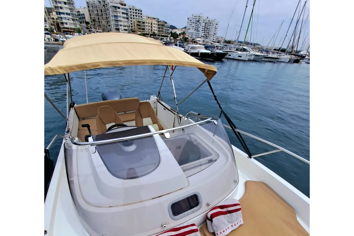 Exterior view of CORRECAMINOS BEEP BEEP, a Jeanneau Cap Camarat 755WA motorboat at Sant Antoni de Portmany, Spain