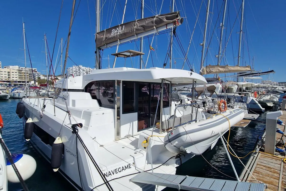 Exterior view of navégame, a Bali Catspace catamaran at Sant Antoni de Portmany, Spain