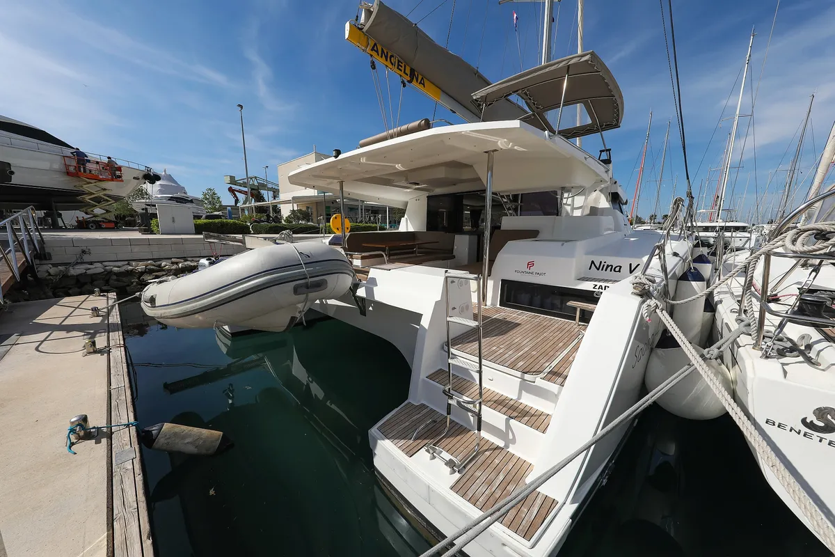 Exterior view of Nina V, a Fountaine Pajot Saona 47 Quintet catamaran at Grad Trogir, Croatia