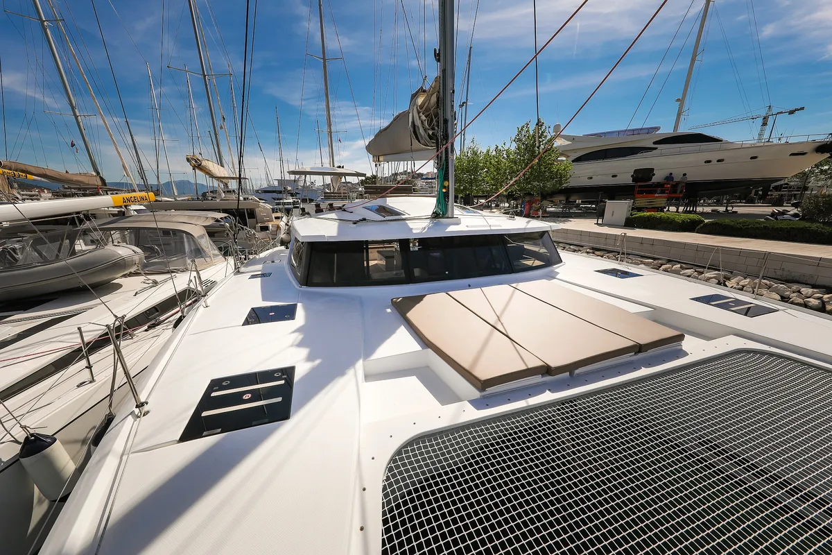 Exterior view of Nina V, a Fountaine Pajot Saona 47 Quintet catamaran at Grad Trogir, Croatia